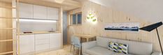 a living room and kitchen area with wood paneling on the walls, white cupboards and shelves