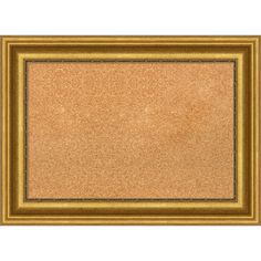 an empty cork board with gold frame