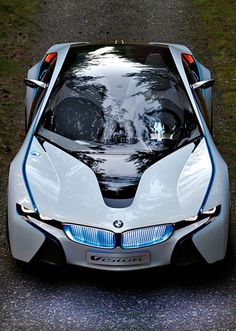 a futuristic car parked on the side of a road