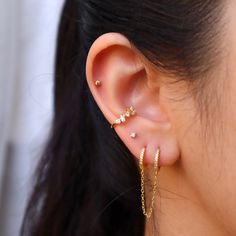 Our tiny diamond earring is perfect for any occasion. It's small size and minimal style makes it perfect as an everyday essential! Wear these studs for your cartilage or earlobe piecing, wear them alone or wear them as an earring stack! Our tiny diamond earring is shipped in a high-quality jewelry bag for storage. SHIPS 1-2 DAYS **Details -A thick layer of 14k Gold layered on .925 sterling silver + e-coat (anti-tarnish) -Clear CZ Stones -Stud size: 2mm -Comes in a pair -Post backs -Hypoallergen: Dainty Single Cartilage Earring For Party, Dainty Single Ear Climber For Parties, Dainty Tiny Ear Climbers For Everyday, Dainty Ear Climbers For Everyday, Dainty Single Cartilage Earring, Tiny Dangle Piercings For Gift, Tiny Dangle Piercings As Gift, Tiny Minimalist Piercings For Anniversary, Gift Huggie Ear Climbers With Ear Wire