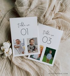 two wedding table numbers on top of a blanket