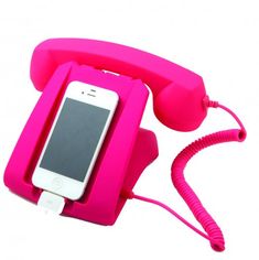 a pink phone with a cord attached to it