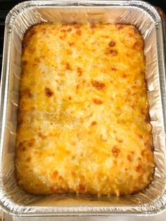 a square casserole dish with cheese on top