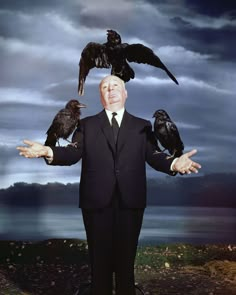 a man in a suit with two crows on his shoulders and one crow perched on his head