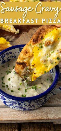 sausage gravy breakfast pizza in a blue and white bowl on a wooden table