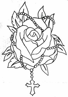 a rose with beads on it is shown in black and white, as well as the cross