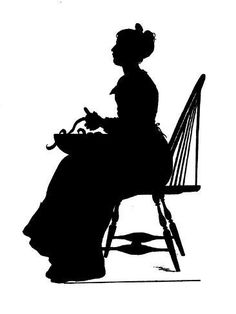 the silhouette of a woman sitting in a chair