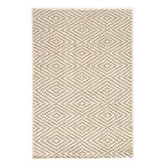 a beige and white rug on a white background with an area rug in the shape of a zigzag pattern