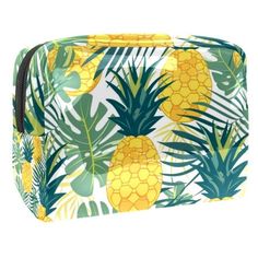 a pineapple and palm leaf print cosmetic bag with zipper closures on the front