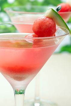 two glasses filled with watermelon and cucumber garnish