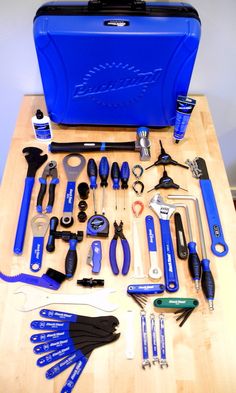 tools are laid out on a table to be used as a toolbox for repair