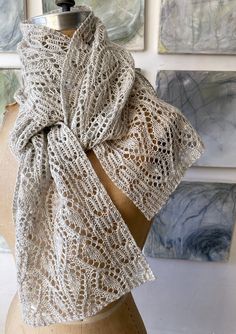 A generously sized, sheer scarf or stole quickly becomes a go-to piece to take a minimalist wardrobe through spring, summer and fall. This luxurious example in four sizes (small scarf/large scarf/petite stole/tall stole) is graced with a lush foliage motif, bordered with prim leaf buds. The stitchwork is simple and easily memorized, but the effect is lusty and deeply embossed, every leaf surrounded by yarnover highlights. Gorgeous in a smooth luxury blend, this design translates nicely for cool Knit Throw Blanket Pattern, Throw Blanket Pattern, Sheer Scarf, Small Scarf, Silk Knit, Knit Throw Blanket, Lace Knitting Patterns, Large Scarf, Minimalist Wardrobe