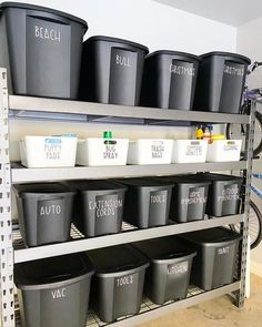 several bins are stacked on the shelves in a storage room with bikes and other items