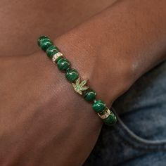 Elevate your accessory game with the Weed Leaf Beaded Bracelet in 18k Yellow Gold. Crafted with a nod to cannabis culture, this bracelet features a beaded band with iced out roundels and a weed leaf in the center filled with emerald hand-set stones. Perfect for celebrating 4/20 year-round, this bracelet adds a touch of edge to any outfit. Made with quality materials and attention to detail, it's the perfect way to express your style! This product is guaranteed for life – GLD will repair or repla Vermeil Jewelry, Custom Earrings, Gold Plated Bracelets, Drop Necklace, Pendant Bracelet, Chain Pendants, Bracelet Sizes, Womens Bracelets, Beaded Bracelet