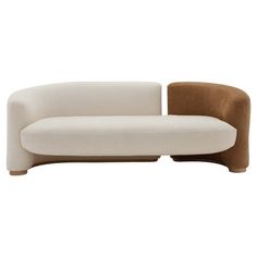 a white and brown couch sitting next to each other