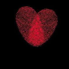 a fingerprint in the shape of a heart on a black background with red ink