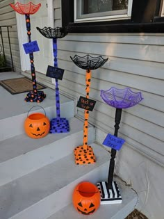 halloween decorations on the front steps of a house