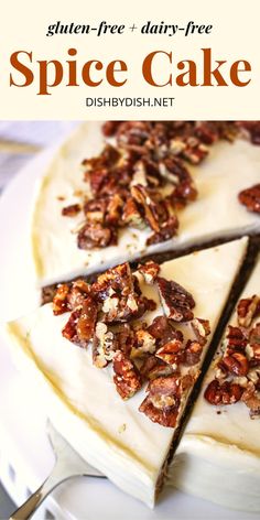 a cake with white frosting and pecans on top