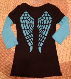 a black and blue shirt with wings on it