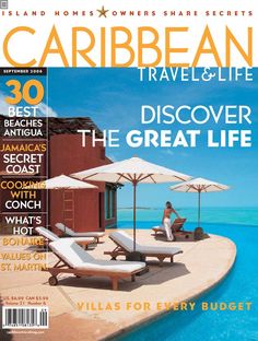 a magazine cover with two lounge chairs and umbrellas on the beach in front of an ocean