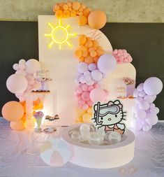 a hello kitty themed birthday party with balloons