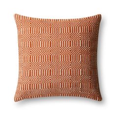 an orange and white pillow on a white background with the pattern made from squares in different sizes