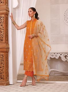 Sleeveless Salwar Kameez Dupatta Pakistani Eid Dress is an epitome of elegance and tradition and it gives you a head-turning appearance on the festive occasion. This perfectly stitched Kameez Trouser is emblazoned with lavish designs and embroideries, making it an epitome of beauty and grace. Kameez: The beautiful kameez in mustard yellow shade comes in premium chiffon fabric and it gives you a lavish look on Eid day. Lavish designs, booti details, and embroidery work make this long kameez an ep Sleeveless Salwar, Sleeveless Kameez, Long Kameez, Zainab Chottani, Eid Dress, Luxury Clothing Brands, Kurta Neck Design, Eid Dresses, Casual Party Dresses