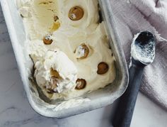 an ice cream sundae in a pan with spoons