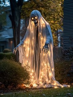 a lighted ghost standing in the yard