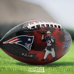 a football on the field with an image of tom brady