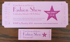 two pink tickets with the words fashion show on them sitting next to each other in front of a wooden table