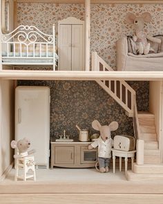 a doll house with furniture and toys in it