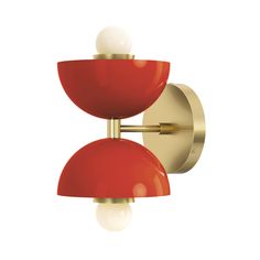 a red and gold wall light with two white balls on the top of each bulb