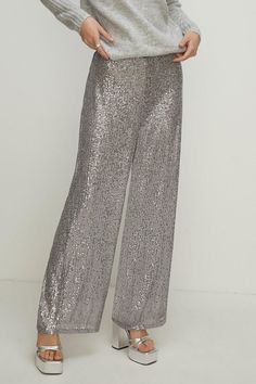 A wardrobe hero, updated for the festive season. Designed in a classic wide leg style with a flattering high-rise finish, these trousers come complete with high-shine sequins for an invite-ready feel. Pair with silk blouses and strappy heels for an elevated evening look. Christmas Party Shoes, Silk Blouses, Party Handbags, Velvet Clothes, Sequin Outfit, Christmas Party Outfits, Oasis Fashion, Evening Shoes, Court Shoes