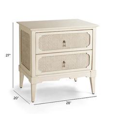 a white cabinet with two drawers and wicker handles on the bottom, against a white background