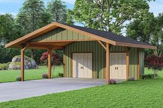 a two car garage with an attached carport in the middle of a grassy area