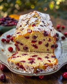 a loaf of cranberry bread sitting on top of a white plate