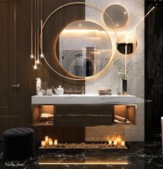 an elegant bathroom with candles and lights on the vanity area, along with a round mirror