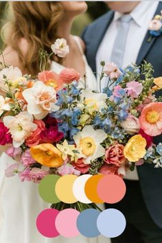 a bride and groom holding a bouquet of flowers in front of their wedding color scheme