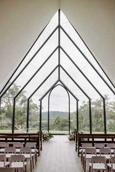 the inside of a church with rows of pews and tables in front of it