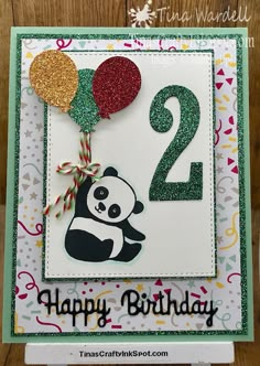 a birthday card with a panda holding balloons and the number two on it's side