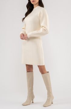 Show off cozy-chic style in this funnel-neck sweater-dress fashioned with gently puffed sleeves and directional ribbed stitches. 34 1/2" length Slips on over head Funnel neck Long sleeves 58% acrylic, 27% polyester, 15% nylon Hand wash, dry flat Imported Christmas Dress With Boots, Cozy Ribbed Sweater Dress For Winter, Spring Ribbed High Neck Sweater Dress, Cozy Ribbed Winter Sweater Dress, Chic Cream Ribbed Sweater Dress, Fall Cable Knit Knee-length Sweater Dress, Cream Ribbed Sweater Dress For Spring, White Ribbed Sweater Dress For Winter, Fitted Chunky Knit Long Sleeve Sweater Dress