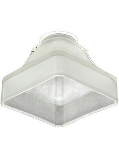 a white light fixture on a white background