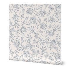 a white and blue floral wallpaper with flowers on the side, in front of a white background