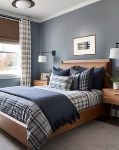 a bedroom with blue walls and plaid bedding