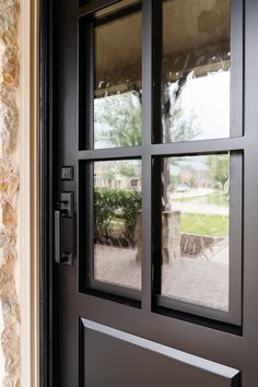 a black door with two glass panes on it