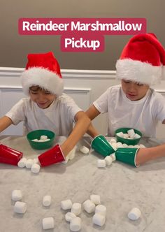 two children in santa hats making marshmallows at a table with the caption reindeer marshmallow pick up