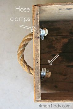 an old wooden box with rope hanging from it's sides and the words hose clamps