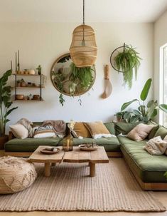 a living room filled with lots of green furniture and plants on the wall above it