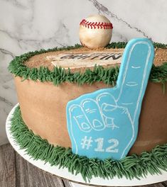 a birthday cake with a baseball and glove on the top that says 12 1 / 2